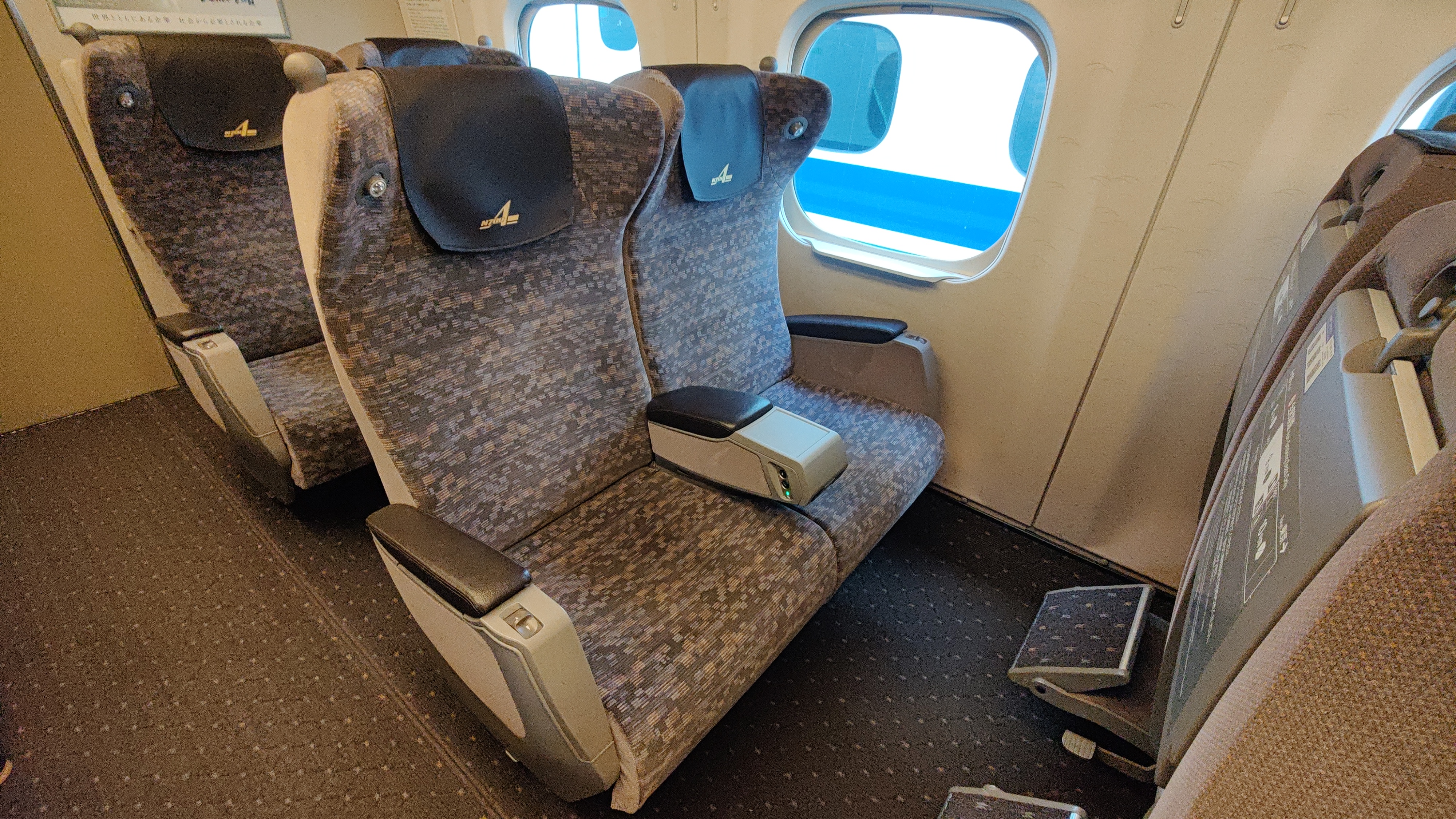 Seats inside one of shinkansen's first class compartment.