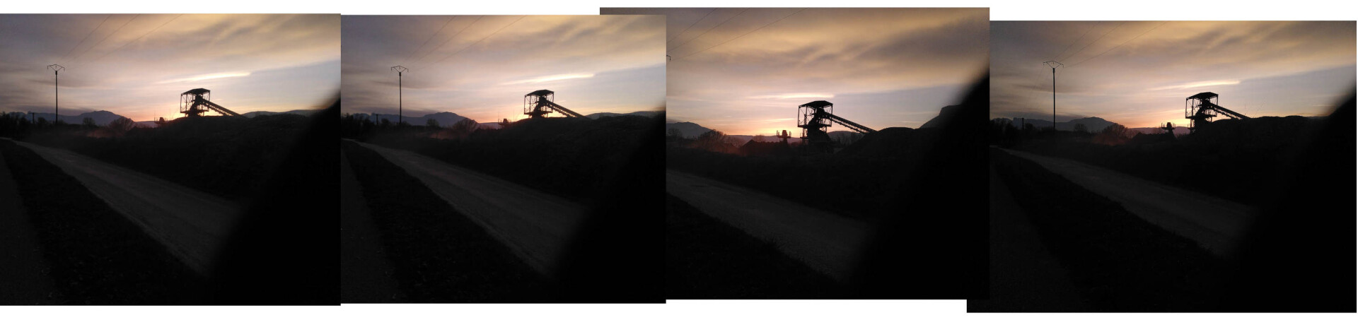 sunset sky with silhouettes of mining machines and electrical posts.